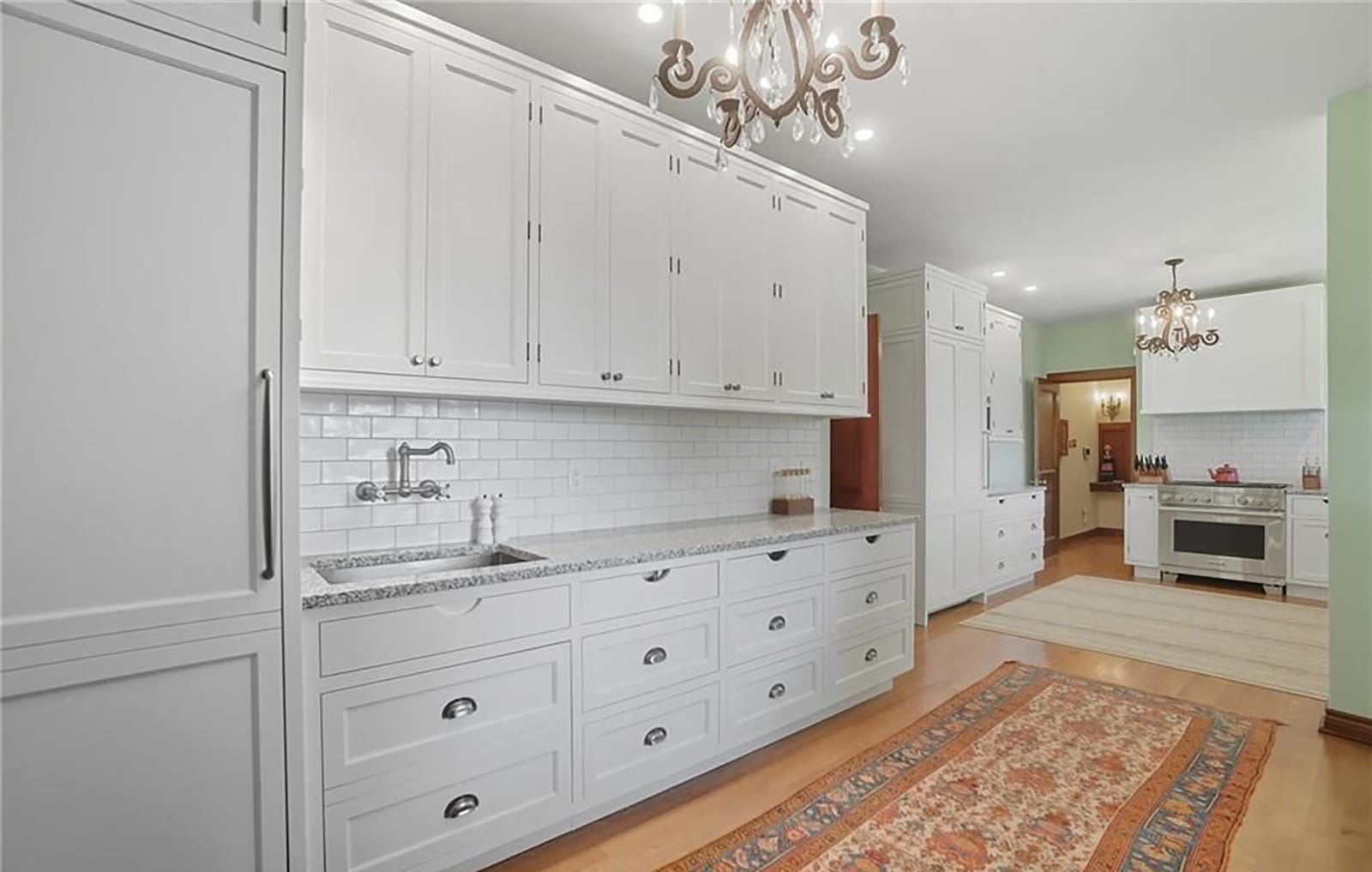 The newly designed and updated kitchen has two rooms with built in cabinets and two sinks. It also has professional grade appliances. CONTRIBUTED