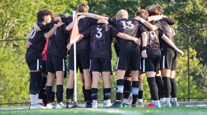 The Badin boys soccer team huddles before its game against Elder on Friday at the Matandy SportsPlex in Hamilton. CHRIS VOGT / CONTRIBUTED