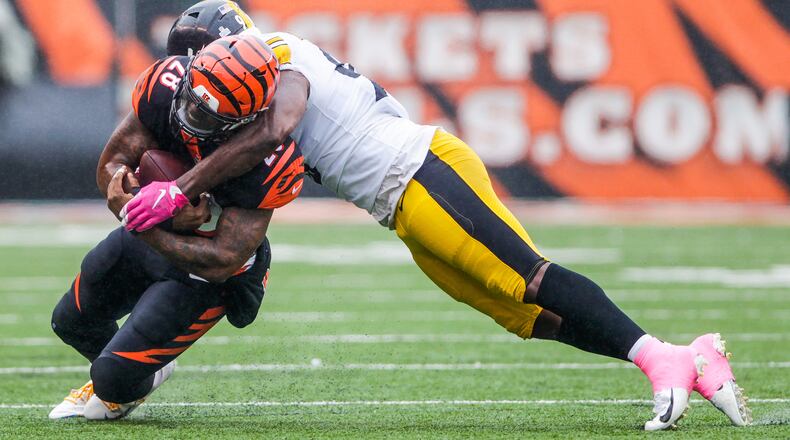 Cincinnati Bengals running back Joe Mixon is tackled by Pittsburgh Steelers linebacker Vince Williams during their game Sunday, Oct. 14 at Paul Brown Stadium in Cincinnati. NICK GRAHAM/STAFF