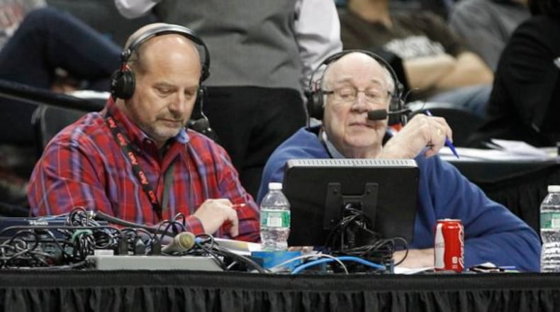 WHIO's Larry Hansgen, left, and Bucky Bockhorn broadcast the Flyers' victory over Fordham in the second round of the A-10 tournament on Thursday, March 13, 2014, at the Barclays Center in Brooklyn, N.Y.