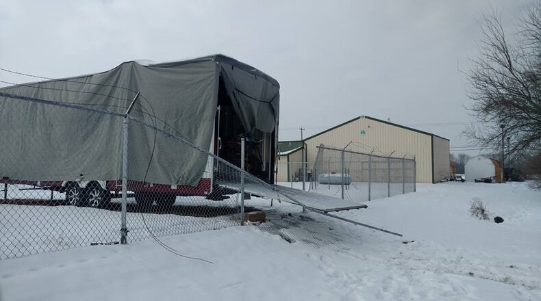 Thieves damaged a fence and stole an ATV among other items that were stored in this camper on Ledbetter Road in Xenia.