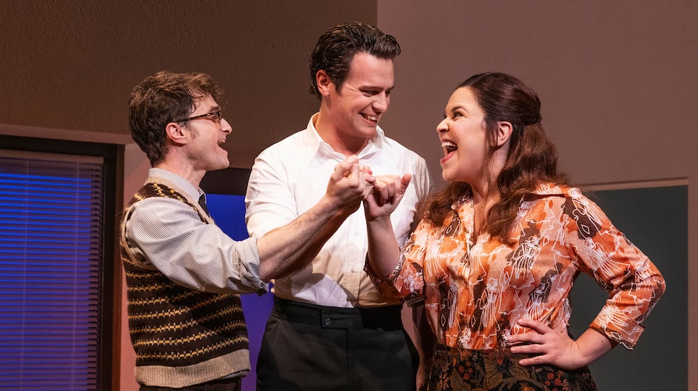 This image released by Polk & Co. shows Daniel Radcliffe, from left, Jonathan Groff and Lindsay Mendez in a scene from "Merrily We Roll Along." (Matthew Murphy/Polk & Co. via AP)