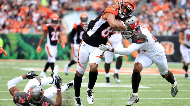 Justin Evans #21 of the Tampa Bay Buccaneers attempts to tackle Tyler Boyd #83 of the Cincinnati Bengals during the second quarter at Paul Brown Stadium on October 28, 2018 in Cincinnati, Ohio. (Photo by Andy Lyons/Getty Images)