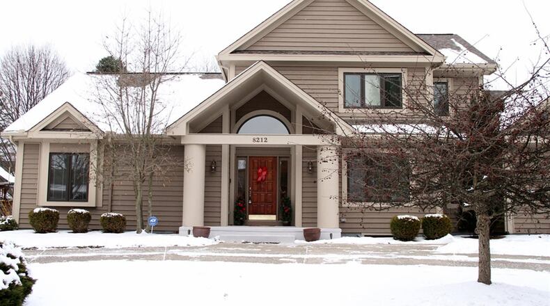 The home has about 4,100 sq. ft. of living space, including a finished basement with updated full bathroom. The house sits on a curved corner lot with a circular driveway. CONTRIBUTED PHOTOS BY KATHY TYLER