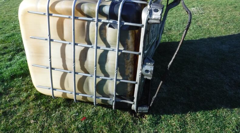 Police are asking for help identifying individuals suspected of dumping hazardous liquids on the Beavercreek Golf Course from the pictured construction tank. CONTRIBUTED