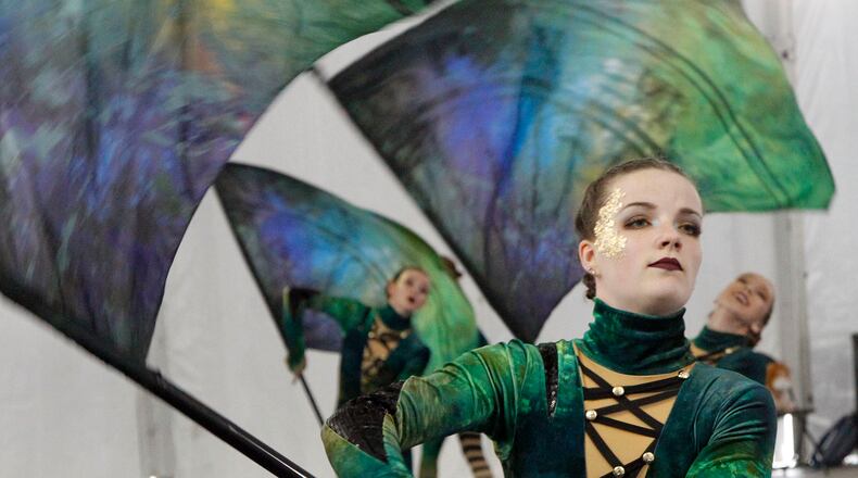 Miamisburg High School World Guard member Crystal Rooks, 18, warms up for Winter Guard International competition at UD Arena on Thursday morning. TY GREENLEES / STAFF