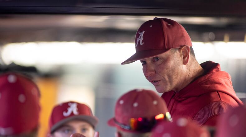 FILE - Alabama coach Brad Bohannon talks with the team in the dugout after Alabama rallied in the bottom of the ninth for a 5-4 win over Xavier in an NCAA college baseball game Feb. 18, 2022, in Tuscaloosa, Ala. An Indiana man whose son is a member of the University of Cincinnati baseball team is the bettor at the center of separate investigations that led to firings of Bohannon and two members of the Cincinnati baseball staff this month, two people familiar with the inquiries told The Associated Press on Friday, May 26. (AP Photo/Vasha Hunt, File)