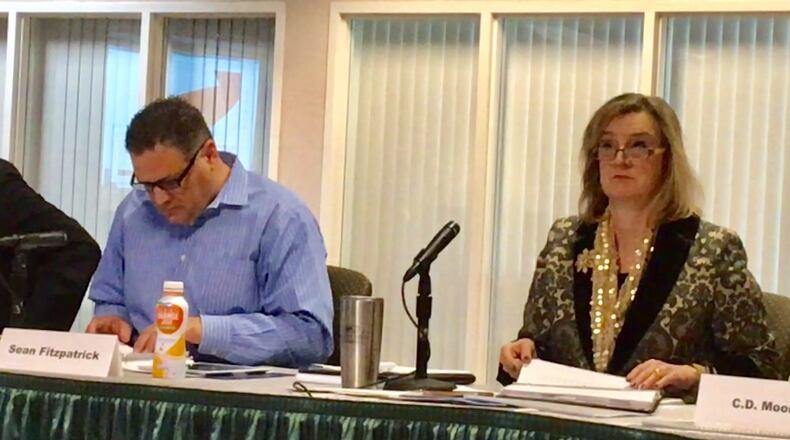 Chairman of Wright State’s finance committee Sean Fitzpatrick and university president Cheryl Schrader sit at a board of trustees meeting on Friday.