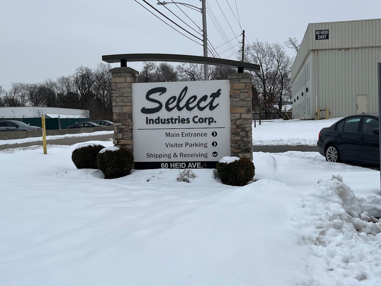 A sign at the visitors parking lot to Select Industries' 60 Heid Ave. plant on Jan. 14, 2025. THOMAS GNAU/STAFF