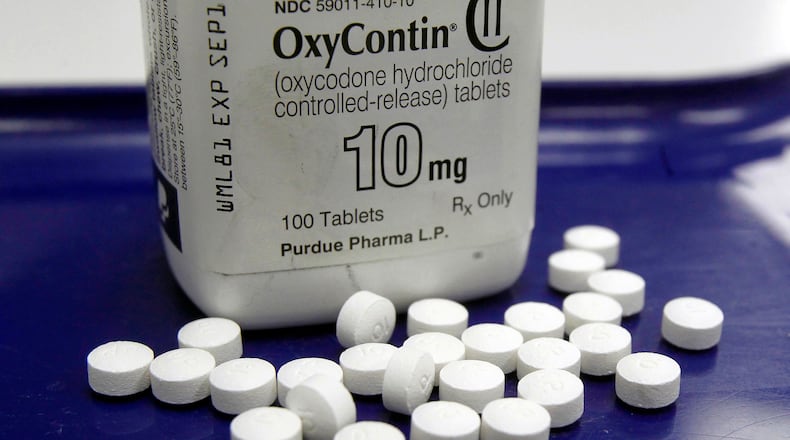 FILE - This Feb. 19, 2013, file photo shows OxyContin pills arranged for a photo at a pharmacy in Montpelier, Vt. Nevada has struck a $45 million settlement deal with McKinsey & Company for the global consulting firm's role in advising opioid makers how to sell more prescription painkillers amid a national overdose crisis. The western state reached the deal after sitting out a multi-state settlement with McKinsey announced in February. The hard bargaining has allowed Nevada to win a settlement that's three and a half times larger than the average settlement with other states. (AP Photo/Toby Talbot, File)