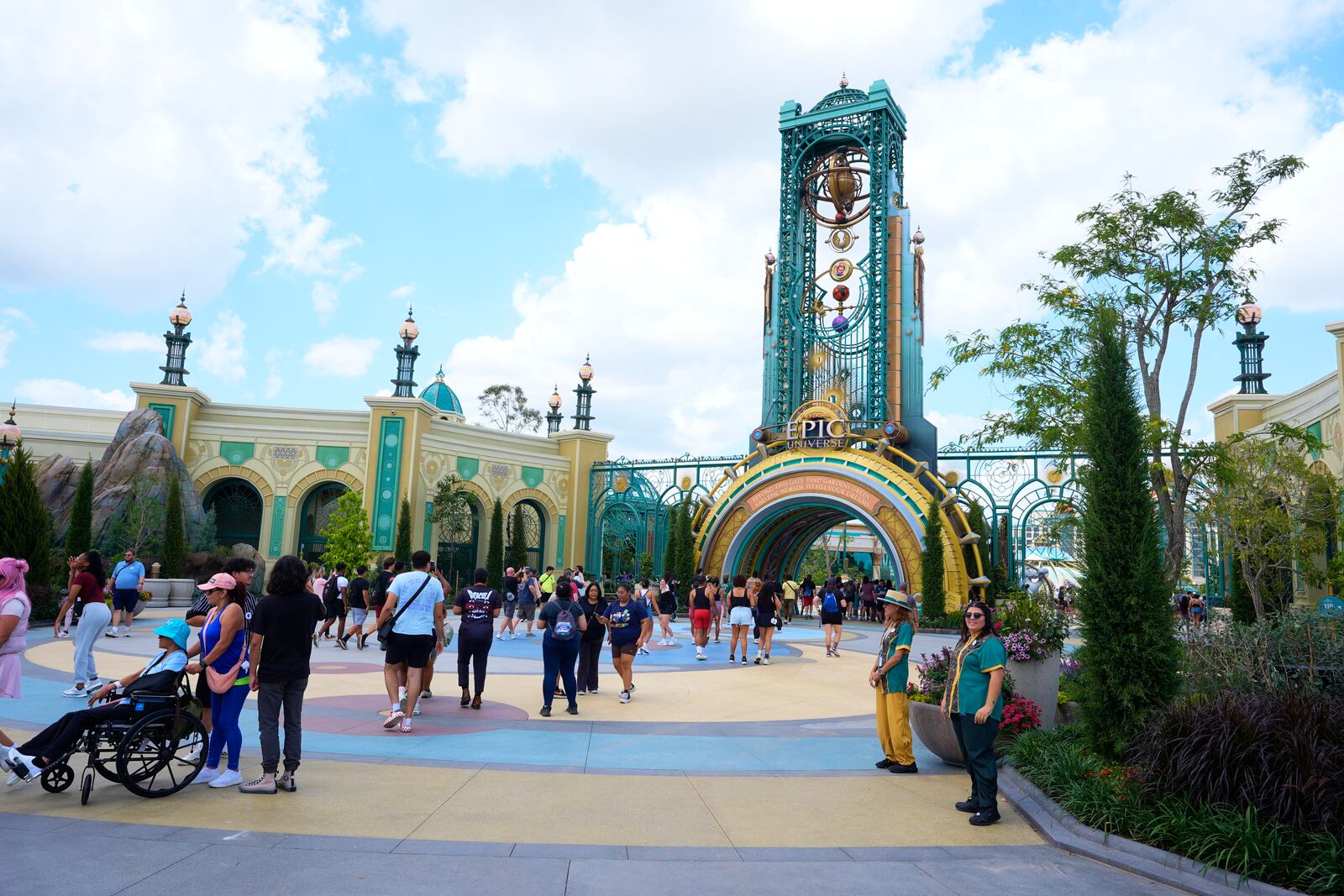 Guests arrive at the main entrance to Epic Universe Theme Park at Universal Resort Orlando Thursday, April 10, 2025, in Orlando, Fla. (AP Photo/John Raoux)