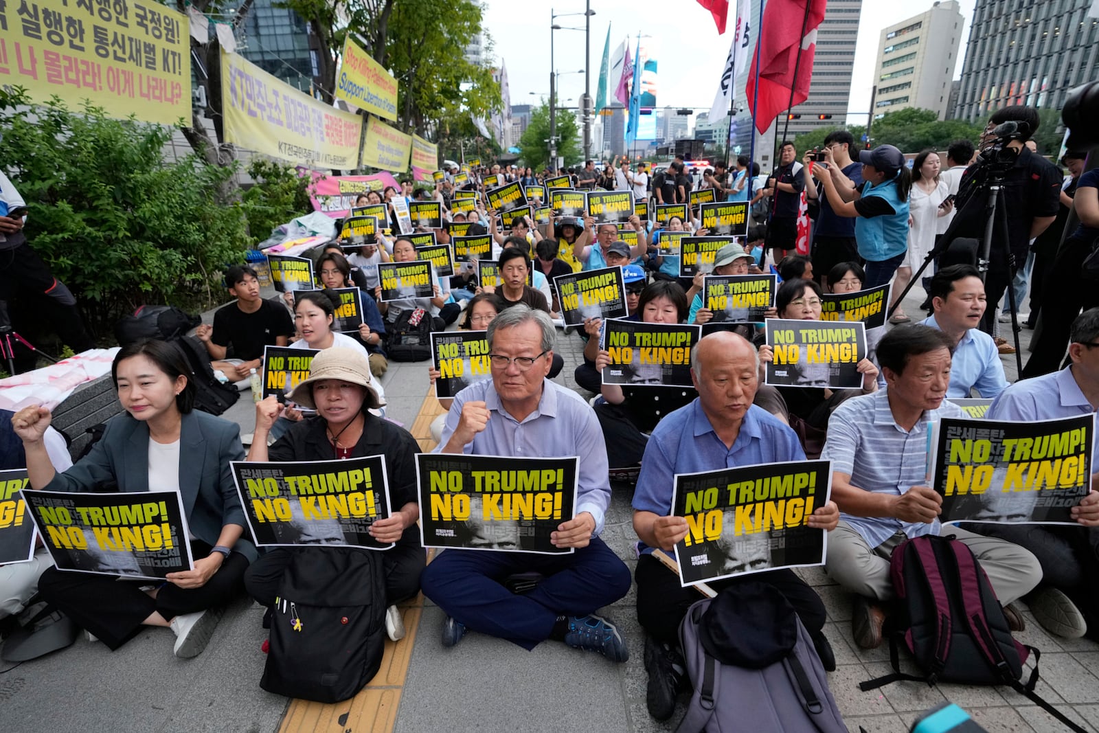 South Korean protesters stage a rally against U.S. President Donald Trump's tariffs policy on South Korea, near the U.S. Embassy in Seoul, South Korea, Wednesday, July 30, 2025. (AP Photo/Ahn Young-joon)