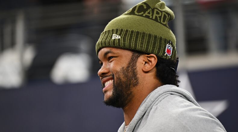 Arizona Cardinals quarterback Kyler Murray works out on the sideline before an NFL football game against the Dallas Cowboys, Monday, Nov. 3, 2025, in Arlington, Texas. (AP Photo/Jessica Tobias)