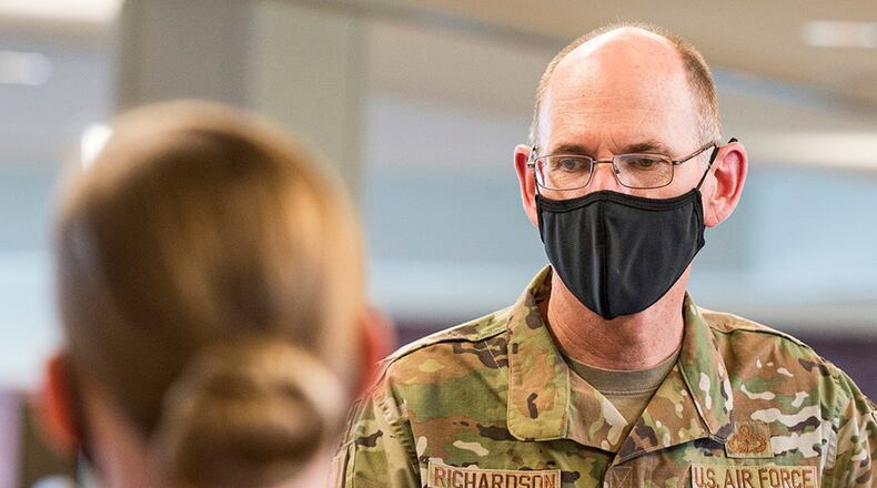 Gen. Duke Richardson, Air Force Materiel Command commander, listens to a brief by Master Sgt. Veronica Tannery of resiliency resources Aug. 22 at Wright-Patterson Air Force Base. Richardson and other base leaders were given tours and demonstrations of many Wright-Patt facilities and capabilities. U.S. AIR FORCE PHOTO/JAIMA FOGG