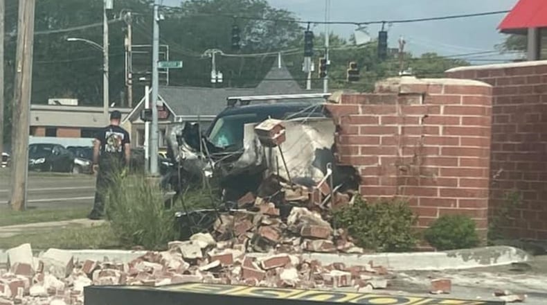 At least one person was injured after a crash into a Waffle House sign in Dayton. CONTRIBUTED/JALEN WHARTON