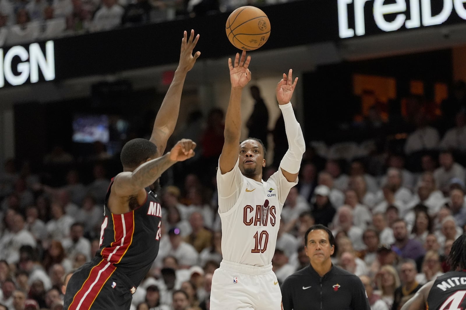 Cleveland Cavaliers guard Darius Garland (10) shoots as Miami Heat forward Haywood Highsmith, left, defends in the second half in Game 2 of an NBA first-round playoff series, Wednesday, April 23, 2025, in Cleveland. (AP Photo/Sue Ogrocki)