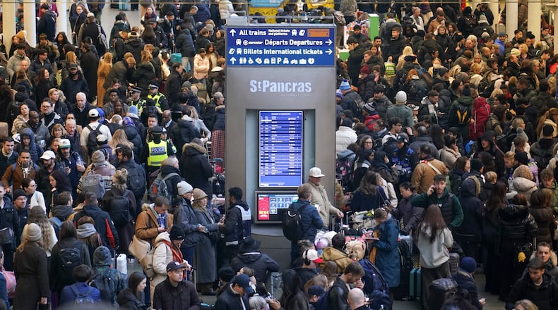 Travelers queue for Eurostar services at St Pancras International station in London, Tuesday, Dec. 30, 2025. (AP Photo/Alberto Pezzali)