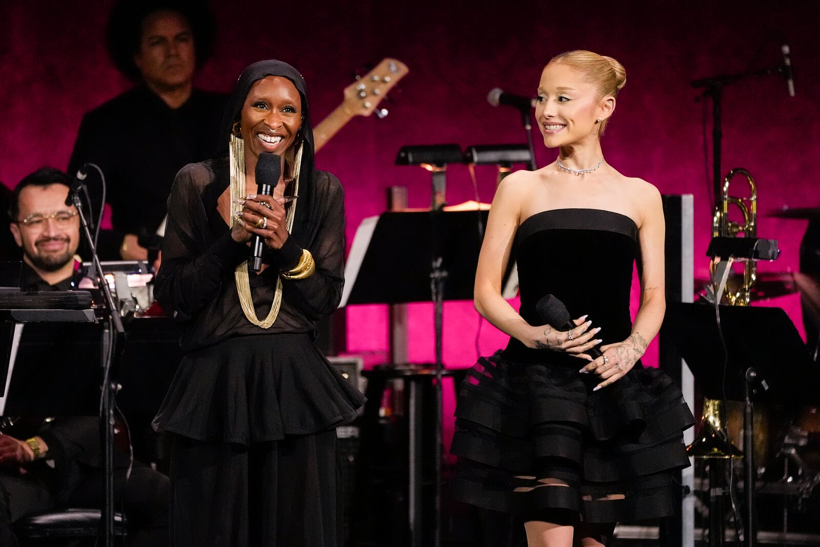 Cynthia Erivo, left, and Ariana Grande, cast members of the upcoming film "Wicked: For Good," speak during the Universal Pictures and Focus Features presentation at CinemaCon on Wednesday, April 2, 2025, at Caesars Palace in Las Vegas. (AP Photo/Chris Pizzello)