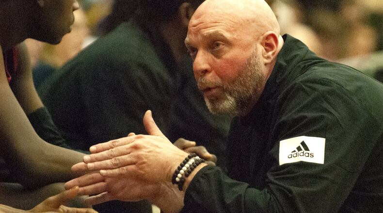 Trotwood-Madison coach Rocky Rockhold talks to players on his bench during the second half of Sunday’s Flyin’ To The Hoop game at Trent Arena against Akron St. Vincent-St. Mary. Jeff Gilbert/CONTRIBUTED