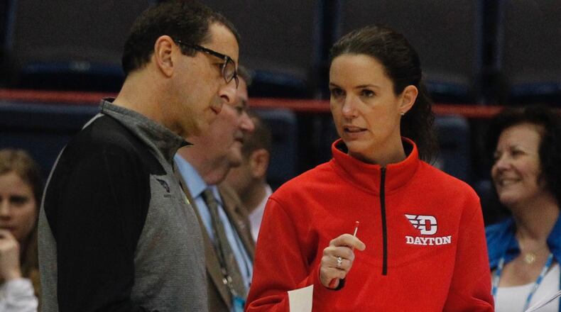 Dayton head coach Jim Jabir, left, and assistant coach Shauna Green talk during practice on Friday, March 27, 2015, at the Times Union Center in Albany, N.Y. David Jablonski/Staff