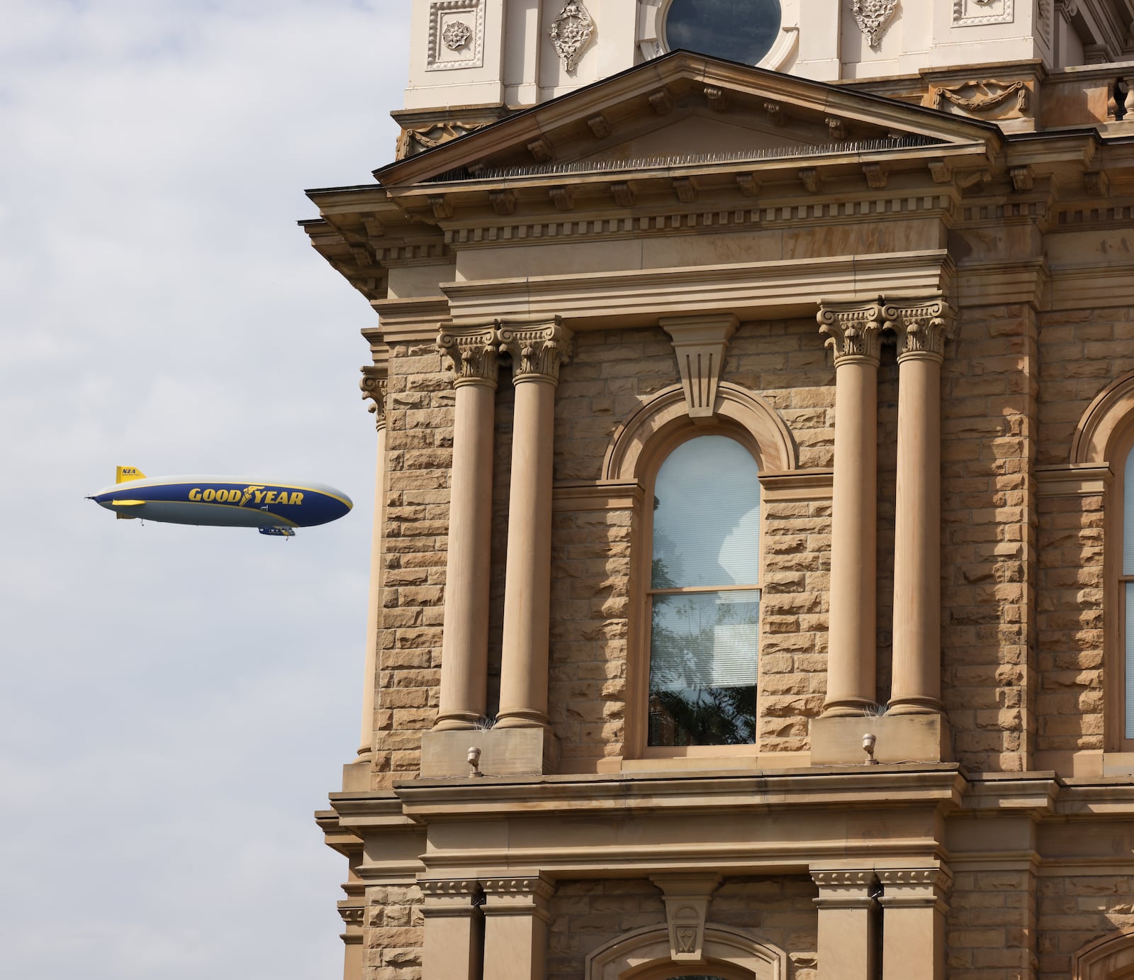 The Goodyear Blimp flies over Troy on Friday, June 20. Select people rode in the airshop on Friday. BRYANT BILLING / STAFF