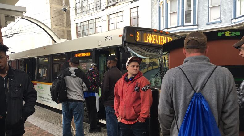 Riders gather to catch buses at the Greater Dayton RTA hub downtown in this 2016 file photo. JOSH SWEIGART / STAFF