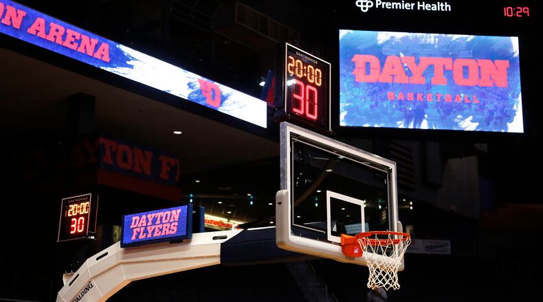 New baskets with two shot clocks and LED stanchion lights are part of phase on renovations at UD Arena. TY GREENLEES / STAFF