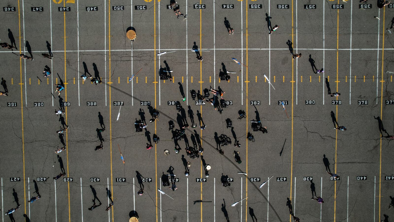 Beavercreek  High School marching band practices on the parking lot of the school Friday July 26, 2024. JIM NOELKER/STAFF