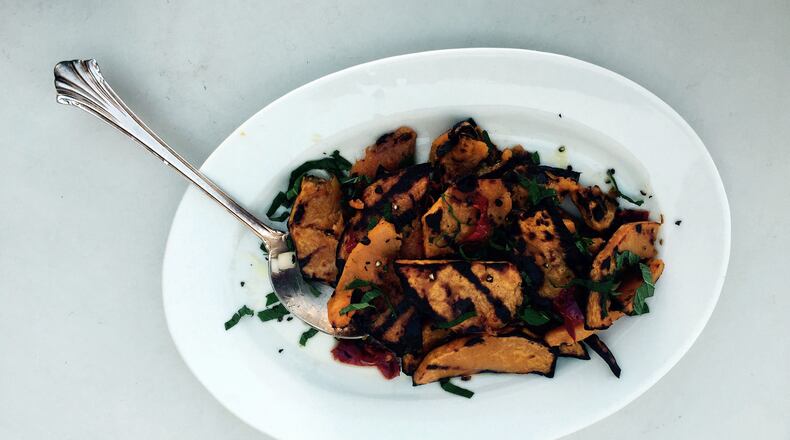 Grilled butternut squash with chili peppers and mint is a nice transitional dish between summer and fall. (Melissa McCart/Pittsburgh Post-Gazette/tns)