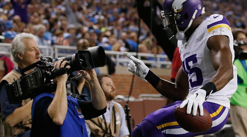 DETROIT, MI - DECEMBER 14: Greg Jennings #15 of the Minnesota Vikings celebrates a second quarter touchdown into a TV camera while playing the Detroit Lions at Ford Field on December 14, 2014 in Detroit, Michigan. (Photo by Gregory Shamus/Getty Images)