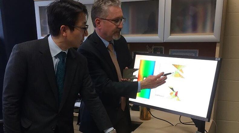 Dr. Keisuke Umezawa (left) of the Air Systems Research Center in the Japanese Ministry of Defense and Dr. David Mollenhauer with the Air Force Research Laboratory’s Composite Performance Research Team partner to research usability, capability and needs of research software. (U.S. Air Force photo/Donna Lindner)