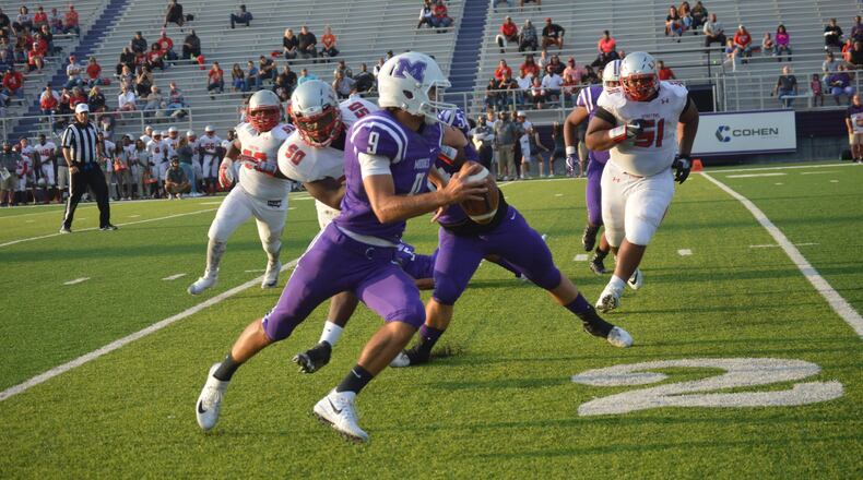 Middletown quarterback Zach Maloney (9) tries to scramble around Lima Senior’s Jarius Cobb (50) and Rico Williams (51) on Friday night at Barnitz Stadium in Middletown. The visiting Spartans earned a 34-14 victory. CONTRIBUTED PHOTO BY MARITZA MCKINNEY