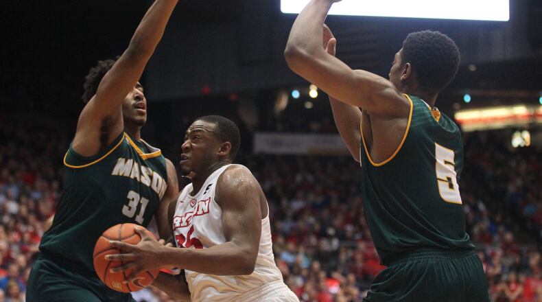 Dayton’s Kendall Pollard drives to the basket against George Mason on Feb. 21, 2017, at UD Arena. David Jablonski/Staff