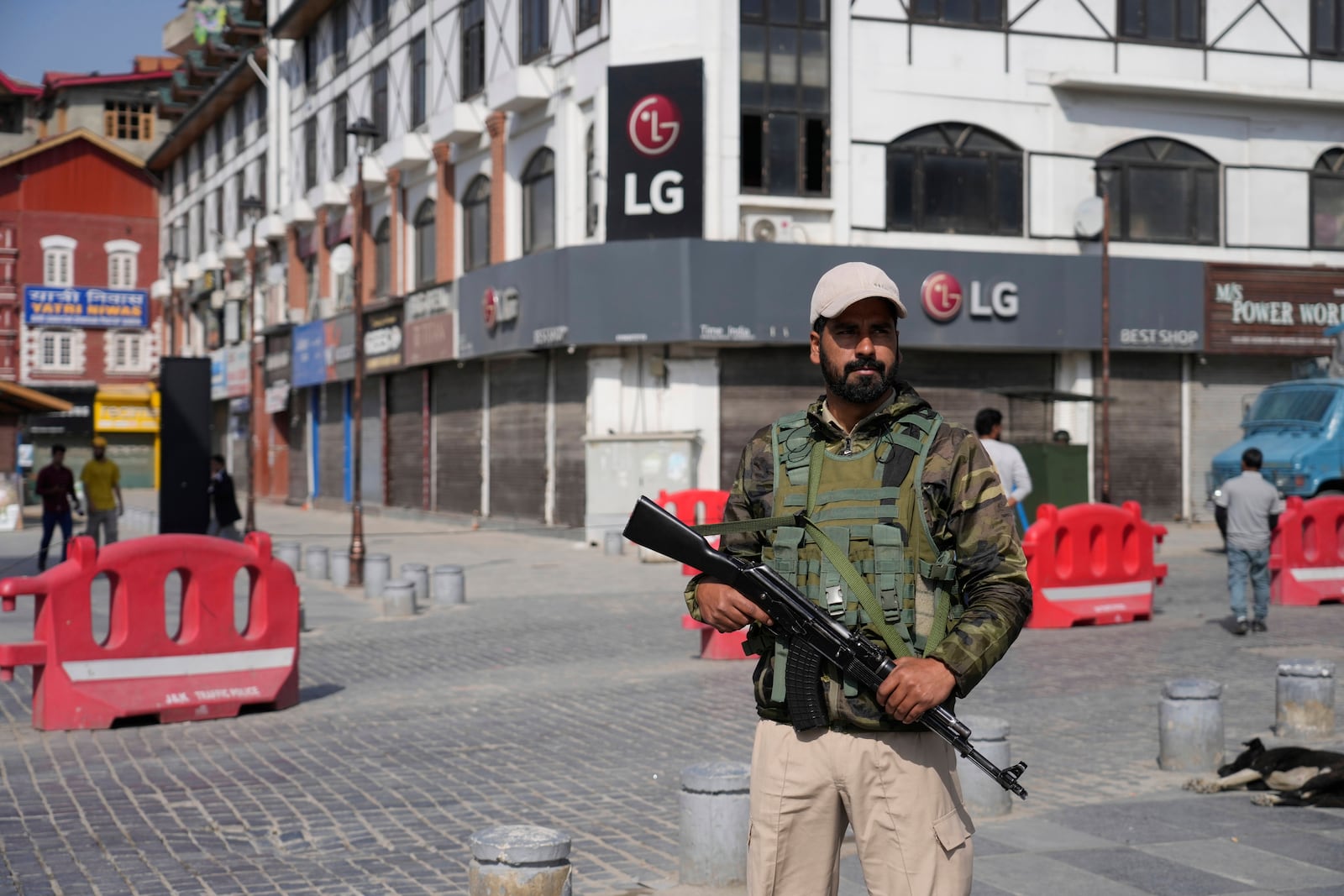 An Indian policeman guards in the city centre during a shut down after tourists were killed, in Srinagar, Indian controlled Kashmir, Wednesday, April. 23, 2025. (AP Photo/Mukhtar Khan)