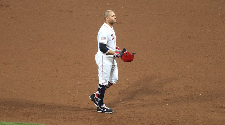The Reds' Joey Votto reacts after flying out with the bases loaded in the seventh inning against the White Sox on Monday, July 2, 2018, at Great American Ball Park in Cincinnati.