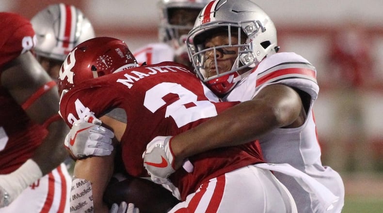 Ohio State’s Dre’mont Jones tackles Indiana’s Mike Majette on Thursday, Aug. 31, 2017, at Memorial Stadium in Bloomington, Ind. David Jablonski/Staff
