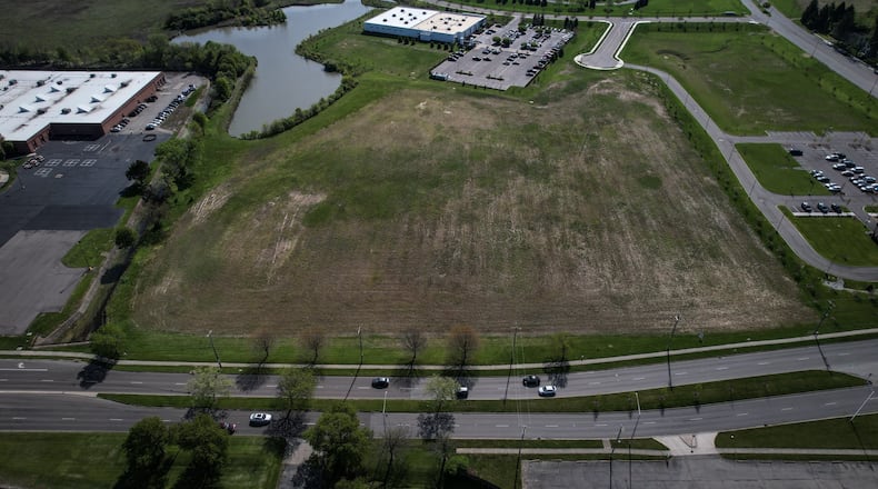 The Dayton Regional STEM School plans to break ground on its new elementary school at Kettering’s Miami Valley Research Park next month. The existing STEM school building is at the left edge of the photo, with Woodman Drive at the bottom. Jim Noelker/ Staff