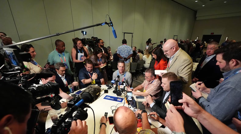 New York Giants head coach John Harbaugh talks with reporters at the annual NFL football meetings, Monday, March 30, 2026, in Phoenix. (AP Photo/Ross D. Franklin)