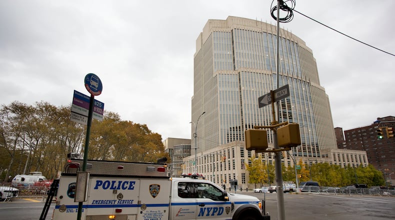 FILE - The New York Police Department has extra security in place in front of the Brooklyn Federal Courthouse for the start of jury selection in the trial of Joaquin "El Chapo" Guzman, Nov. 5, 2018, in New York. (AP Photo/Mark Lennihan, File)