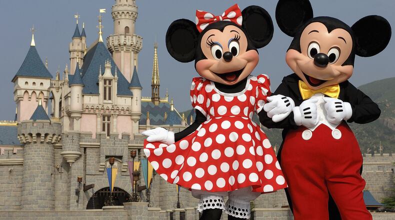 HONG KONG - SEPTEMBER 1: (EDITORIAL USE ONLY) In this handout photo provided by Disney, Mickey and Minnie Mouse are seen in front of the Sleeping Beauty Castle at the new Disneyland Park on September 1, 2005 in Hong Kong. The new theme park and vacation resort will officially open September 12. (Photo by Mark Ashman/Disney via Getty Images)