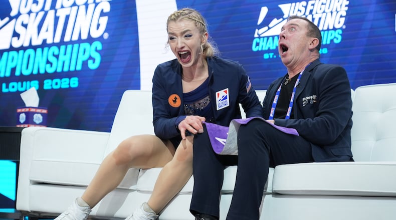 Amber Glenn reacts to seeing her scores after competing during the women's free skating competition at the U.S. Figure Skating Championships, Friday, Jan. 9, 2026, in St. Louis. (AP Photo/Stephanie Scarbrough)