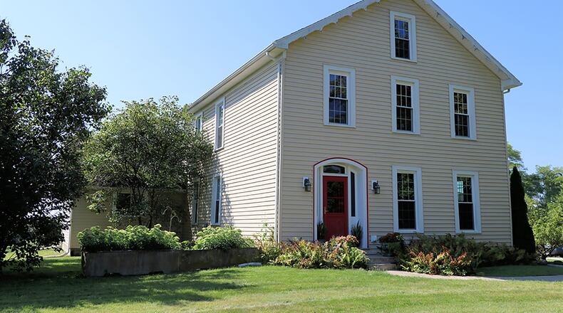 The 2-story farmhouse has about 3,520 sq. ft. of living space. The picturesque setting is nestled within 5 acres that surround an 1850s farmhouse and accompanying barns and out-building of this former dairy farm located within Cedarville Twp. CONTRIBUTED PHOTO BY KATHY TYLER