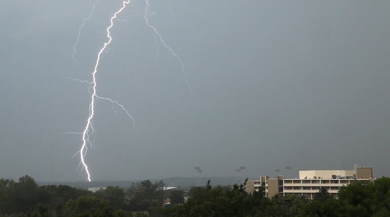2012: Lightning strikes western Montgomery County as seen from S. Main St. on Wednesday, July 18 when thunderstorms moved through the area.. The Dayton Marriot is in the foreground, right.--Staff Photo by Ty Greenlees