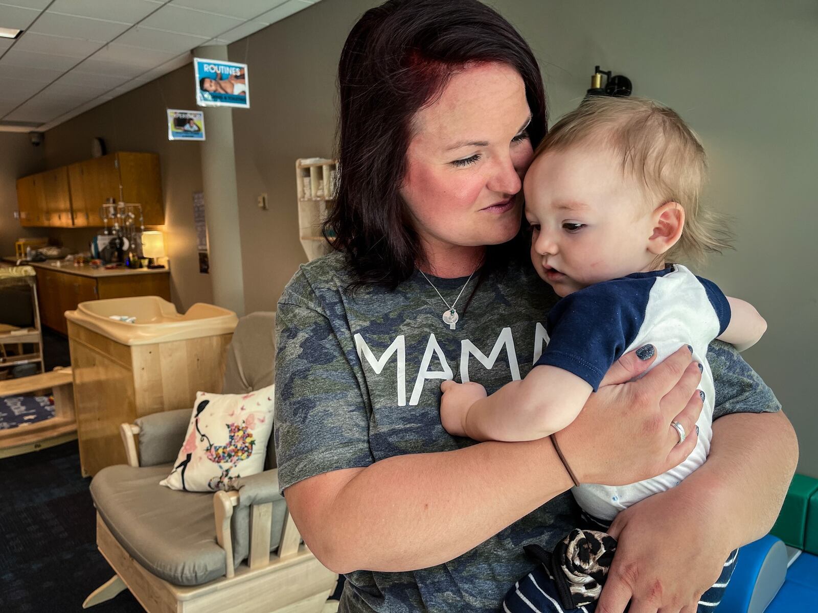 Sinclair Community College student Madison Gray picks-up her son, Calvin Gray at the Early Childhood Education Center in building nine Friday May 14, 2021. JIM NOELKER/STAFF
