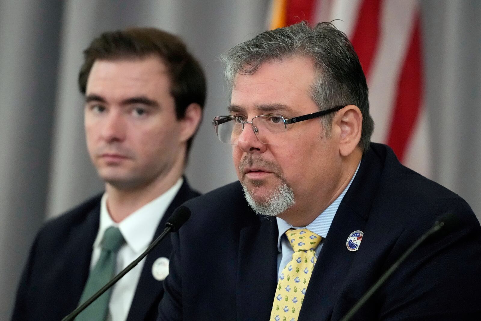 Commissioner Donald Palmer speaks as General Counsel Camden Kelliher looks on, during the U.S. Election Assistance Commission Standards Board in-person public meeting, Thursday, April 24, 2025, in Charlotte, N.C. (AP Photo/Chris Carlson)