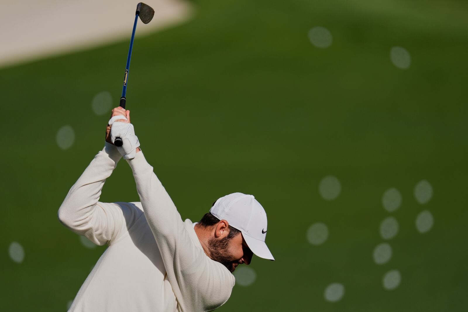 Scottie Scheffler hits on the driving range during a practice round at the Masters golf tournament, Tuesday, April 8, 2025, in Augusta, Ga. (AP Photo/George Walker IV)
