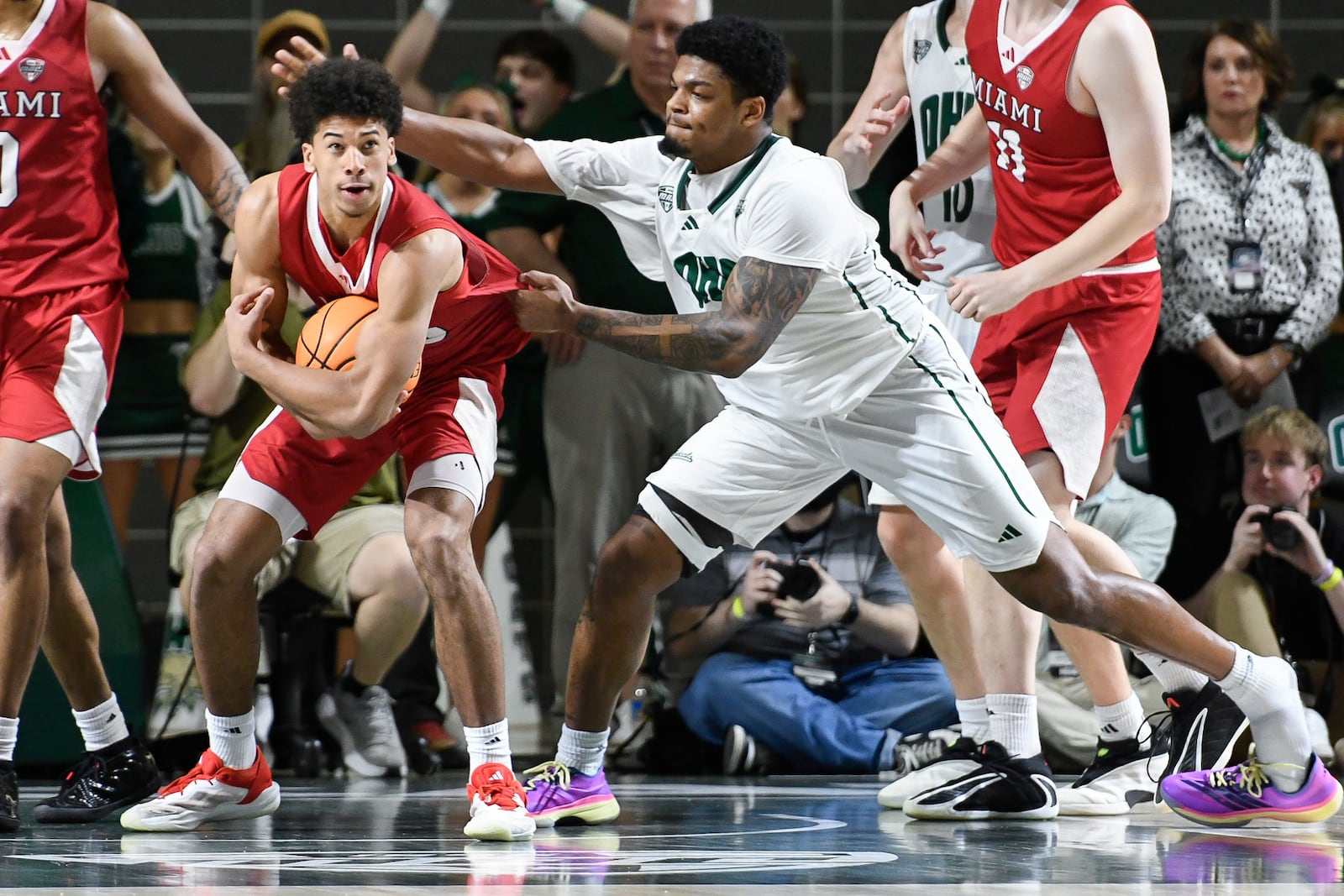 Miami guard Justin Kirby (6) secures a rebound during overtime of an NCAA college basketball game against Ohio, Friday, March 6, 2026, in Athens, Ohio. (AP Photo/HG Biggs)