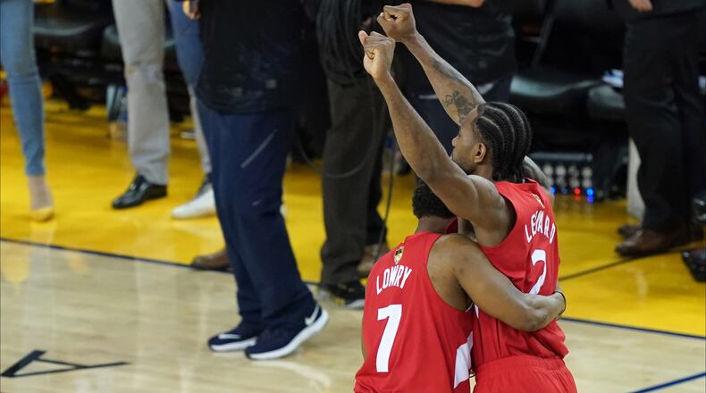 OAKLAND, CALIFORNIA - JUNE 13: Kyle Lowry #7 and Kawhi Leonard #2 of the Toronto Raptors celebrates his teams win over the Golden State Warriors in Game Six to win the 2019 NBA Finals at ORACLE Arena on June 13, 2019 in Oakland, California. NOTE TO USER: User expressly acknowledges and agrees that, by downloading and or using this photograph, User is consenting to the terms and conditions of the Getty Images License Agreement. (Photo by Thearon W. Henderson/Getty Images)