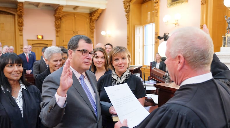 Butler County Area I Court Judge Rob Lyons administers the oath of office to Ohio Rep. George Lang, R-West Chester Twp., who on Wednesday, Sept. 13, 2017, became the representative for the 52nd Ohio House District. CONTRIBUTED