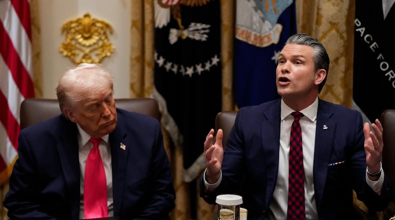 President Donald Trump closes his eyes as Defense Secretary Pete Hegseth speaks during a Cabinet meeting at the White House, Tuesday, Dec. 2, 2025, in Washington. (AP Photo/Julia Demaree Nikhinson)